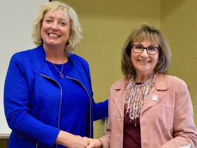 MP Marilyn Gladu presented Mary Jean Hansen, choir director of Synergy 150, with a Community Commendation Award at Camlachie United Church. Melissa Schilz/Postmedia Network