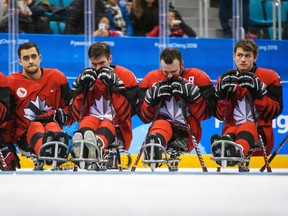 Some members of Team Canada, including Monkton’s Corbyn Smith (right), look dejected after losing a heartbreaking 2-1 decision in overtime in the ice hockey gold medal game between Canada and the United States at the Gangneung Hockey Centre during the Paralympic Winter Games in PyeongChang, South Korea, last Sunday, March 18. Approximately 300 people attended a celebration event to watch the gold medal game at the Elma Logan Arena in Monkton.  JOEL MARKLUND PHOTO
