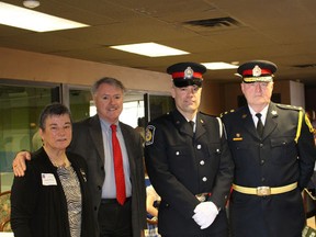 Sarnia Police Const. Gavin Armstrong receives IODE Community Relations award. On hand for the presentation are from left Sarnia-Lambton IODE president Helen Danby, Mayor Mike Bradley, Const. Armstrong, Sarnia Police Chief Phil Nelson and Sarnia-Lambton IODE executive member Leila Boushy on Saturday March 28, 2015 in Sarnia, Ont. 
File photo/Postmedia Network