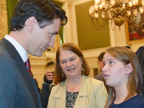 Sarah Calderwood photo 
Toronto cancer survivor Helena Kirk, then 11, uses a planned March 20, 2017 photo shoot with Prime Minister Justin Trudeau in Ottawa to tell him of the need for more funding for childhood cancer research and access to clinical trials for young patients. With them was then-Health Minister Jane Philpott. Local families now affiliated with her Helena's Hope campaign met recently with Bay of Quinte MP Neil Ellis to make similar pleas.