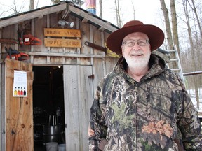 Bruce Jakeman, standing next to his evaporator, is a fountain of knowledge when it comes to maple syrup. (Chris Funston/Sentinel-Review)