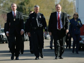 Bureau of Alcohol, Tobacco, Firearms and Explosives Special Agent in Charge Fred Milanowski, front left, Interim Austin police chief Brian Manley, front center, and FBI Special Agent in Charge Christopher Combs, front right, arrive for a news conference near the site of Sunday's explosion, Monday, March 19, 2018, in Austin, Texas. Fear escalated across Austin on Monday after the fourth bombing this month — this time, a blast that was triggered by a tripwire and demonstrated what police said was a "higher level of sophistication" than the package bombs used in the previous attacks. (AP Photo/Eric Gay)