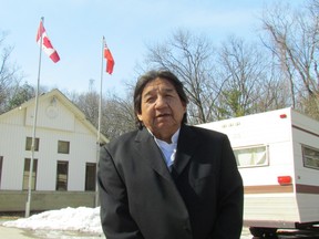 Maynard T. George stands Tuesday, March 20, 2018, outside a trailer parked at the entrance of Pinery Provincial Park. He and other members of his family say the park is part of a large tract of land owned by their ancestors that was never properly surrendered. They moved the trailer to the park entrance this week. (Paul Morden/Sarnia Observer)