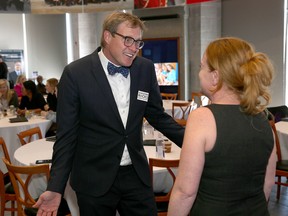 Keynote speaker and best selling author Andrew Davis speaks with Kingston Economic Development Corporation CEO Donna Gillespie after a presentation at the Fort Henry Discovery Centre in Kingston on Tuesday March 20 2018. Ian MacAlpine/The Whig-Standard/Postmedia Network