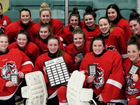 The Lambton Central Lancers celebrate their 1-0 overtime win against the Wallaceburg Tartans in the LKSSAA 'A-AA' girls' hockey final at Wallaceburg Memorial Arena in Wallaceburg, Ont., on Thursday, March 1, 2018. (Mark Malone/Postmedia Network)