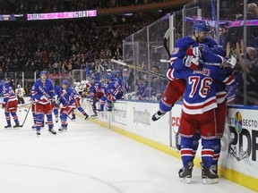 The New York Rangers celebrate their overtime victory over the Pittsburgh Penguins at Madison Square Garden on March 14, 2018 in New York City. The Rangers defeated the Penguins 4-3 in overtime. (Photo by Bruce Bennett/Getty Images)