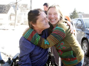 Kevin Danuk is presented with a wheelchair by his niece Sabrina Kreiner on Tuesday. Danuk’s family rallied around him, helping purchase a $500 wheelchair for him. Last week, Danuk's wheelchair was stolen from outside his Donovan home while it was charging on the side of his building. Gino Donato/Sudbury Star/Postmedia Network