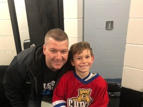Seven year-old Sarnia hockey player Henry Bulzsa (pictured with Novice Tier 1 Sarnia Red Devils coach Ron Page) was one of ten amateur players from across Ontario to be selected as a Penalty Free MVP by the Hockey Development Centre for Ontario. 
Handout/Sarnia This Week