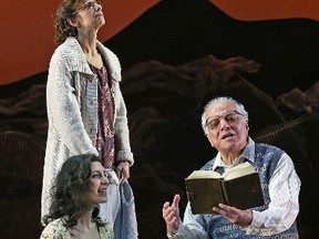 Mirian Katrib, seated, Natascha Girgis and Gerry Mendicino in the opening moments of the Grand Theatre production of A Thousand Splendid Suns.
(Claus Andersen/Grand Theatre)