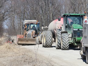 BRUCE BELL/The Intelligencer
Maypul Layn in South Marysburgh was closed Wednesday and Thursday for repairs after a rock drill used to clear the way for transmission lines for the wpd White Pines wind turbine project broke down.