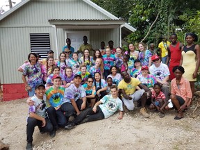 SUBMITTED PHOTO
Members of the Nicholson Catholic College mission trip to Kingston, Jamaica over the March Break are pictured with recipient Novalee Ricketts and her family outside the first house the crew built. The Ricketts family were presented with the keys to the home along with a Bible signed by each of the Nicholson team members.