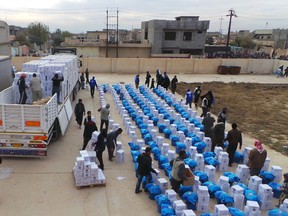 Operations by UN partners, including UNICEF, get underway in the single largest humanitarian aid delivery in eastern Mosul since the current conflict began. WFP/Haider Alithawi. (CNW Group/UNICEF Canada)