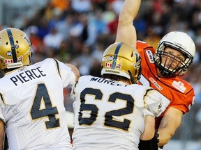 Former defensive lineman Brent Johnson of Kingston, right, and cornerback and special teams standout Barron Miles will be inducted into the Hall later this year, alongside a roster of 2018 inductees that also includes Hank Ilesic, Scott Flory and the late Tommy Hugo. (Postmedia Network file photo)