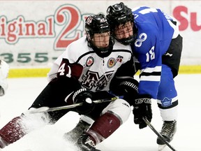 Chatham Maroons' Dane Johnstone (41) and London Nationals' Josh Coyle (18) drive to the Nationals' net late in the third period during Game 6 in their GOJHL Western Conference semifinal at Chatham Memorial Arena in Chatham, Ont., on Thursday, March 22, 2018. (MARK MALONE/Chatham Daily News/Postmedia Network)
