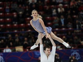 Canada's skater Kirsten Moore Towers and Michael Marinaro perform during pairs free skating program at the Figure Skating World Championships in Assago, near Milan, Thursday, March 22, 2018. (AP Photo/Luca Bruno)