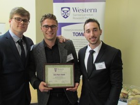 Western University engineering students, from left, Austin Lowes, Carson Otto and Tyler Jobin won the specialty chemicals and environmental category at Friday's 13th annual Capstone Competition held at the Western Sarnia-Lambton Research Park. More than 70 students from the London university took part in this year's engineering competition. (Paul Morden/Sarnia Observer)