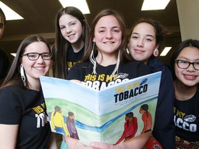 Braeden Manitowabi, Page Chartrand, Anika Chartrand, Logan Daviau, Lilly-Anna Osawamick and Hope Osawamick with the storybook This Is My Tobacco at the official launch at the Shkagamik-Kwe Health Centre on Thursday. Gino Donato/Sudbury Star