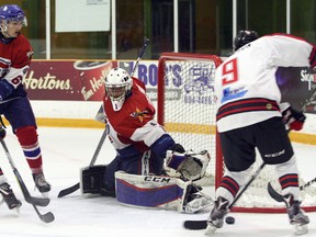 Rayside-Balfour Canadians goaltender Brayden Lachance stretches to make a save while Blind River Beavers forward Owen Robinson (9) looks for a rebound and Canadians defenceman Ryan O'Bonsawin (67) looks to hold off Beavers forward Josh Norman (24) during NOJHL West Division semifinal action at Chelmsford Arena in Chelmsford, Ont. on Friday, March 23, 2018. Ben Leeson/The Sudbury Star/Postmedia Network