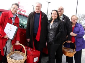 Sarnia Mayor Mike Bradley was helping promote Champions Week recently for the local Meals on Wheels program. Pictured with him are program coordinator Nicole Montgomery, left, the Red Cross' Tammy Fauteux, and program volunteers Ezio and Mena Campomizzi. Tyler Kula/Sarnia Observer/Postmedia Network