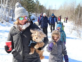 Holly Bazzard and her dog, Sam, tried out the trails at the official opening of the Rainbow Routes Association's New Sudbury Trail on Saturday. The New Sudbury Trail offers nearly four kilometres of new trails to the city's Rainbow Routes trail network. (John Lappa/Sudbury Star)