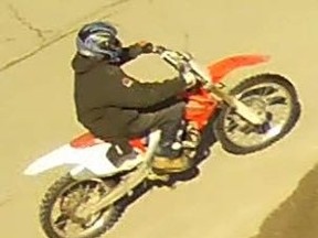 Police are asking for tips from the public regarding the individual riding this dirt bike or the location of the bike. The same vehicle was involved in a disturbing incident at the Santa Claus Parade in November, the police service said. (Photo supplied)