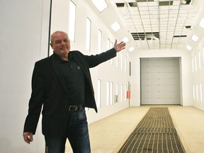 Gunther Haas, CEO of Waltron Trailers, showcases the new painting facility being worked on at the Ridgetown facility. The company is investing $1,018,000 into the operation. Tom Morrison/Chatham This Week