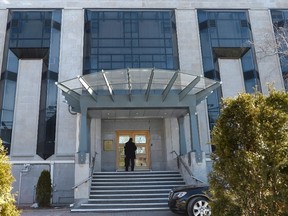 A man enters the Embassy of the Russian Federation to Canada in Ottawa on Monday, March 26, 2018. Foreign Affairs Minister Chrystia Freeland says Canada is expelling four Russian diplomats and will deny permission for three others to bolster Russian staff in Canada. THE CANADIAN PRESS/Justin Tang
