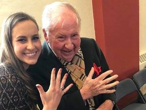 Dayne Zunder is pictured with her grandfather, John Greenberg, at his granddaughter at the Queen's engineering Iron Ring Ceremony on March 18. A card penned by Greenberg to Zunder was taken when a care package of food was stolen earlier this month.