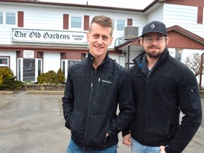Brandon Olsen, left, and Nicholas Olsen stand outside the Old Gardens Flower Shop on Princess Street. It's the site of the new business community hub The Atrium, set to open in July this year. (Louis Pin/Times-Journal)