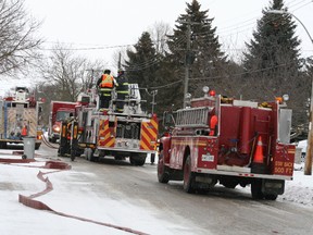 Above, the South Huron Fire Department tends to a house fire at 239 Marlborough Street in Exeter on March 16. As a result of the fire and inspection, Ontario Provincial Police closed the road.