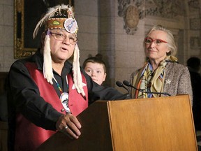 Anishinabek Nation Grand Council Chief Patrick Madahbee provides remarks at the parliamentary media availability prior to the passing of Bill C-61, Anishinabek Nation Education Agreement Act, in the House of Commons Dec. 6, alongside of Alex Hebert of Dokis First Nation and Indigenous Relations and Northern Affairs Minister Carolyn Bennett. File photo by Laura Barrios