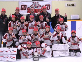 Pictured in the back row from (l-r) are assistant coach Paul Grant, assistant coach Derek McLaughlin, head coach Derrick Leenders, trainer Marty Debruyn and assistant coach Jeff Kerslake. Third row from (l-r) are Hudson Leenders, Cole Smale, Ryan Obre, Kane Barch and Jack Taylor. Second row from (l-r) are Cullen Kerslake, Kallen Grant, Basil McLaughlin, Jesse DeBruyn, Drew Kramer and Myles Phillips. Up front are goaltenders Abbie Wein (left) and Logan Morley (right).(Terry Heffernan/Exeter Lakeshore Times-Advance)