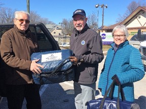 Meals on Wheels week was recognized on March 19-23 across Ontario. In Goderich the service is provided by One Care Home & Community Support Services and the agency invited Goderich Councillor Myles Murdock (centre) to help deliver meals with One Care volunteers Peter and Holly Morrison. Hundreds of volunteers deliver Meals on Wheels across Huron County and Stratford and area, ensuring that seniors have a good hot meal – and delivered with a warm smile. Last year One Care delivered over 32,000 meals. (Contributed photo)