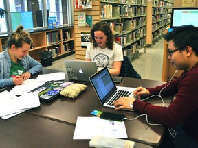 University students Allie Young, Erin Young and William Hong work on some homework at the Chatham branch of the Chatham-Kent Public Library on Feb. 21. Library CEO Tania Sharpe has said more people want to use the library for its space. (Tom Morrison/Chatham This Week)