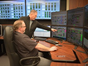 Union Gas senior gas controllers Ian Blackmore, left, and Mike McIntosh are shown in the gas control room at the company's offices on Keil Drive in Chatham. (Handout/Postmedia Network)