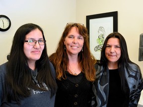 Neepeeshowan Midwives in Attawapiskat First Nation is staffed by (from L-R): Tesla Koostachin-Nakogee, Fetal Alcohol Syndrome Disorder (FASD) worker and aspiring midwife; Christine Roy Sage-Femme, Registered Midwife (SF MW) and Jennifer Tookate, Office Administrator and assistant at births.