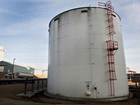 A grain truck passes behind a tank containing denatured alcohol, or ethanol, at the Great River Energy Blue Flint Ethanol plant in Underwood, North Dakota, U.S., on Thursday, Feb. 9, 2012. (Daniel Acker/Bloomberg via Getty Images)