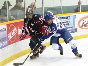 Gianluca Pizzuto left, of the Windsor Spitfires, and Mathieu Dokis-Dupuis, of the Sudbury Nickel Capital Wolves, battle for the puck during action at the Central Region Midget AAA Championship at the Gerry McCrory Countryside Sports Complex in Sudbury, Ont. on Saturday April 1, 2017. John Lappa/Sudbury Star/Postmedia Network