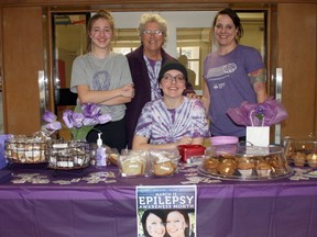 Exeter’s Fletcher family held an epilepsy awareness event at South Huron District High School on March 23. Hannah Fletcher, seated, a Grade 10 student at SHDHS, suffered her first seizure at the age of 12. Pictured with her are her sister Madison, grandmother Hennie Farwell and mom Kelly. (Scott Nixon, Exeter Lakeshore Times-Advance)