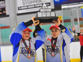 Lucas Hare and Matthew Skinner hoist the Sam Currie Memorial Trophy after the Delhi peewee Rockets captured the OMHA 'C' title Mar. 29 in Delhi.
JACOB ROBINSON/Simcoe Reformer