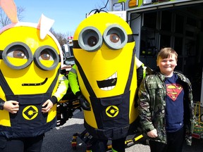 Makail Donaldson, 11, is shown with a couple of EMS Minions during Monday's Easter Eggstravaganza at Kingston Park.Trevor Terfloth/Postmedia Network