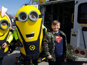 Makail Donaldson, 11, is shown with a couple of EMS Minions during Monday's Easter Eggstravaganza at Kingston Park. (Trevor Terfloth/The Daily News)