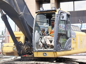 FILE PHOTO
Justin Boutcher operates the back hoe for Wapiti Gravel Suppliers during downtown construction last July.