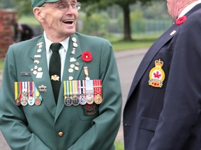 Don Neal speaks with Lloyd Sweet during a wreath-laying ceremony at Sault Ste. Marie Canal National Historic Site in June 2013. (Sault Star File Photo)