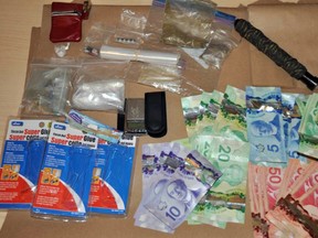 Cash, drugs, packaging materials and a baton found hidden at the Superior Court of Justice in Kingston, Ont. on Thursday, March 29, 2018. Photo supplied by Kingston Police