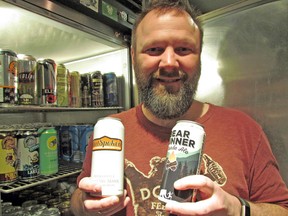 Festival of Beer organizer Steve Alexander displays two of the many brews that will be featured at this year’s event: OutSpoken and New Ontario Brewing Co., product Bear Runner. JEFFREY OUGLER/SAULT STAR
