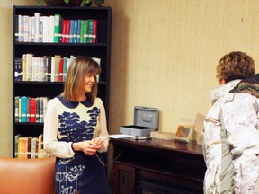 Heike Ingram (left) chats with an acquaintance at the launch of her book, Relentless at the Fairview Library March 28.