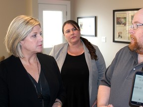 Justin Hayes, right, tells Ontario New Democratic Party Leader Andrea Horwath the difficulties he's encountered access regular dental care during her visit to Bright Smiles Community Dental Hygiene in Chatham, Ont. on Wednesday April 4, 2018. Jordan McGrail, the NDP candidate for Chatham-Kent-Leamington, is also pictured. Ellwood Shreve/Chatham Daily News/Postmedia Network