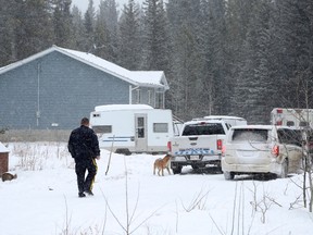 Police attend the scene after an infant was found dead and 14 people were sent to Alberta Children's Hospital from a home on the Stoney Nakoda First Nation, 80 kilometres west of Calgary, Wednesday.
Mike Ridewood / The Canadian Press