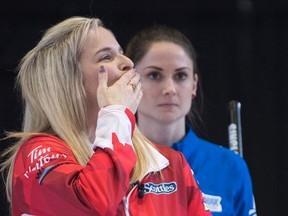 Canada skip Jennifer Jones blows a kiss as United States skip Jamie Sinclair looks on at the Ford World Women's Curling Championship at Memorial Gardens. Paul Chiasson / The Canadian Press